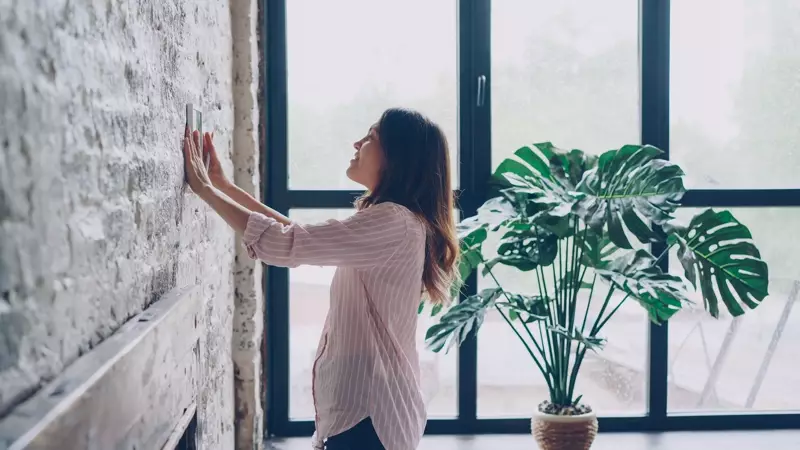 A homeowner in a bright, comfortable living room