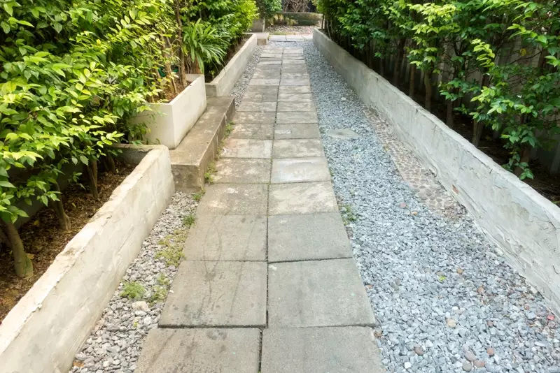 Pebbled walk and lush borders